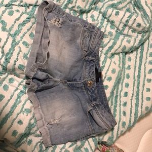 Ripped blue jean shorts
